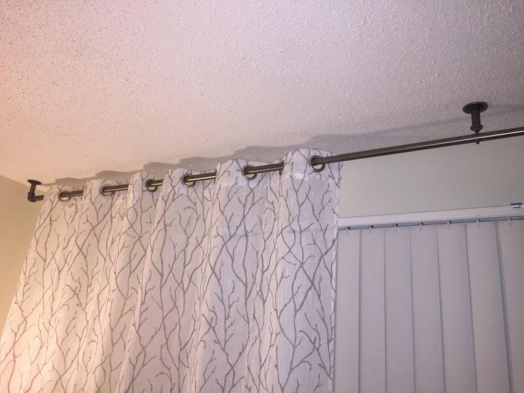Need drapes to hang over vertical blinds? Mount rod to ceiling. Rod from Target. | Living room blinds, Diy blinds, Blinds design